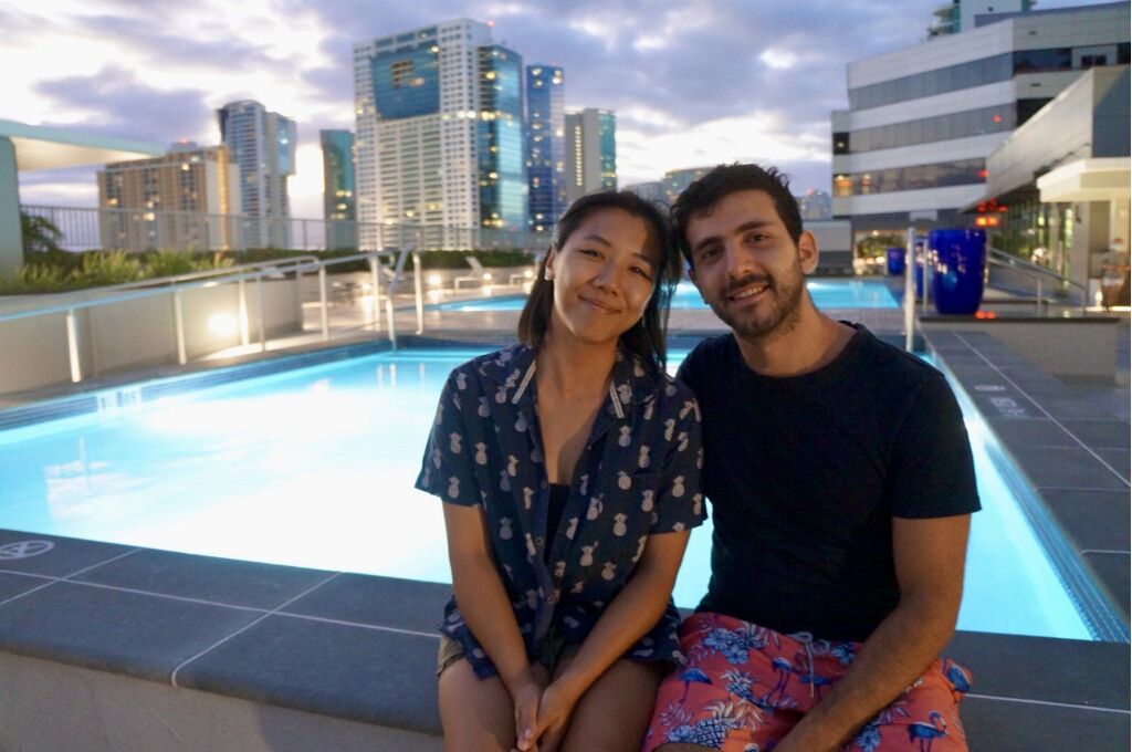 Majd and Amabel at a rooftop pool in Honolulu